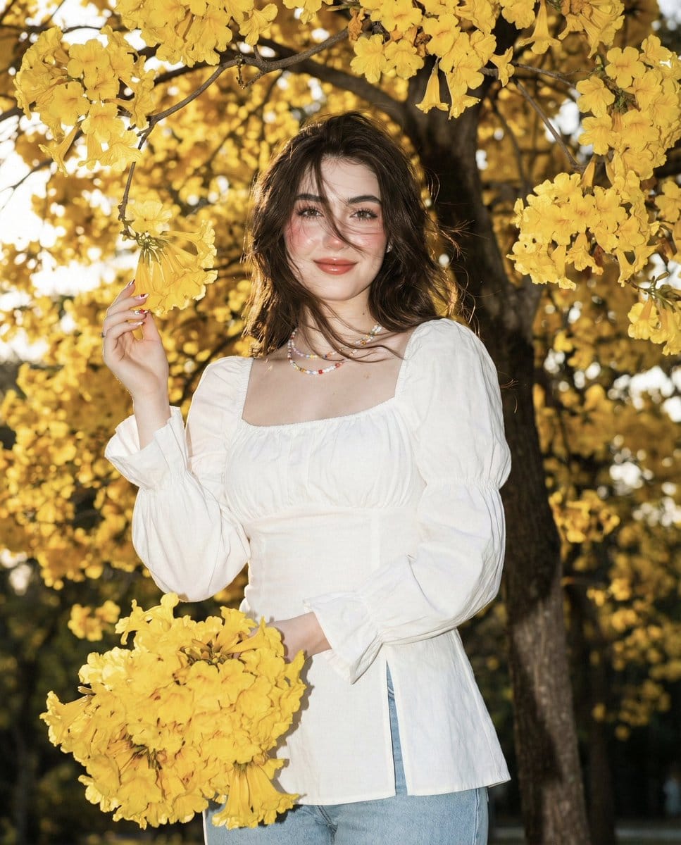Asian Woman Portrait with Golden Trumpet Flowers and Direct Flash