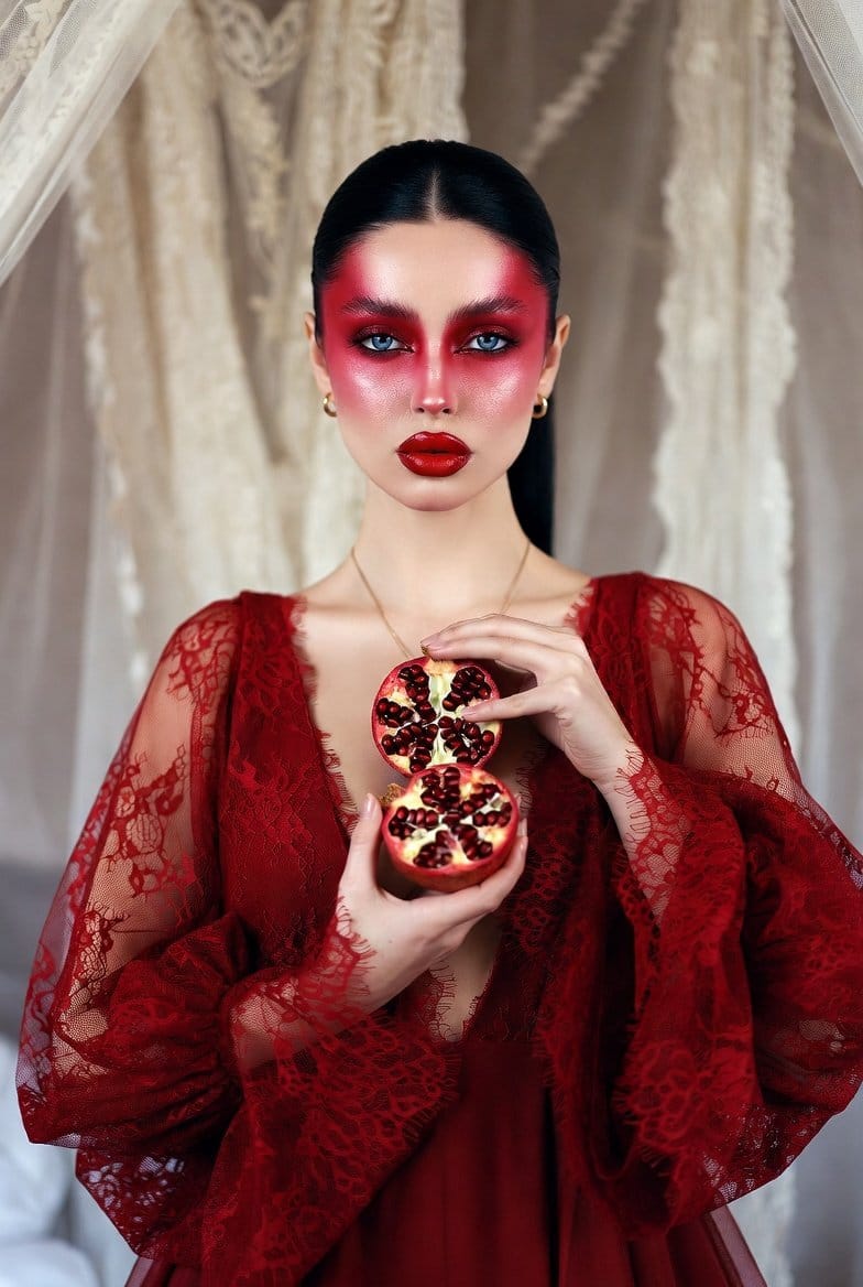 Dramatic Ethereal Portrait of a Woman Holding Pomegranates (Persephone Aesthetic)
